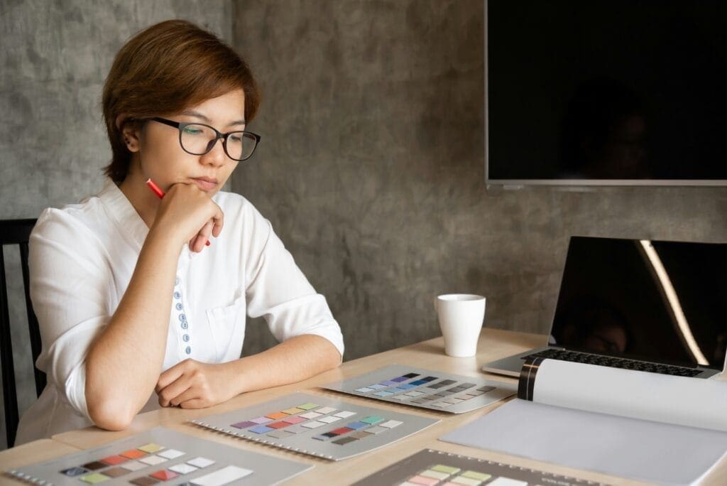 Woman looking at a sheet of paper doing calculations