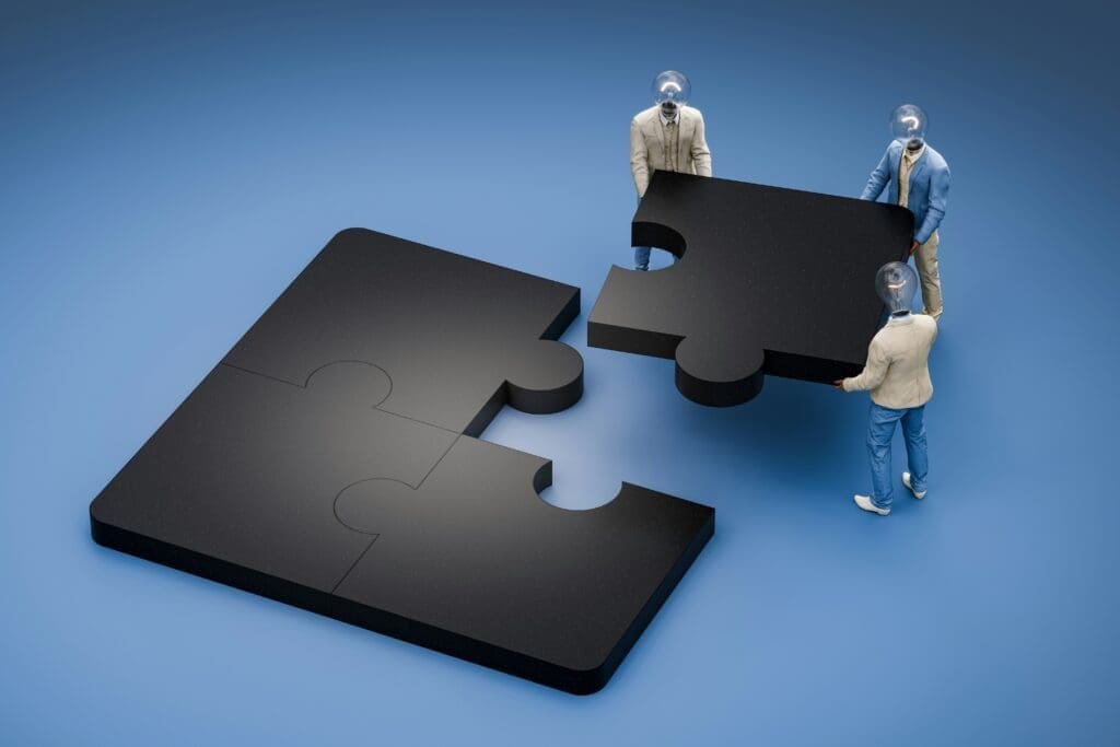 Men putting jigsaw together showing something is missing