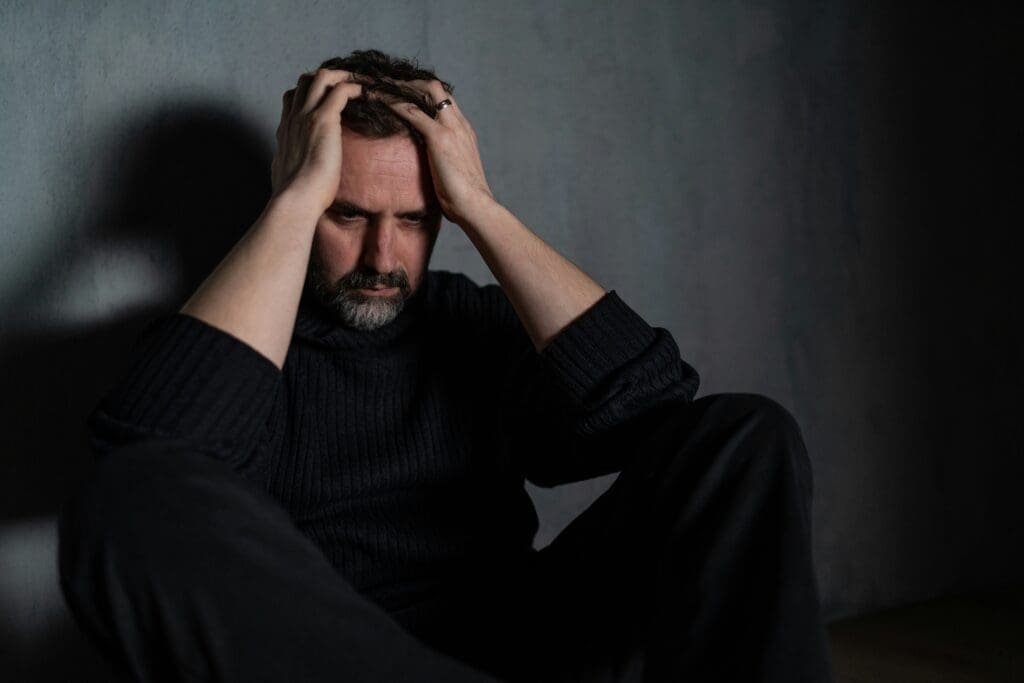 Man with head in hands